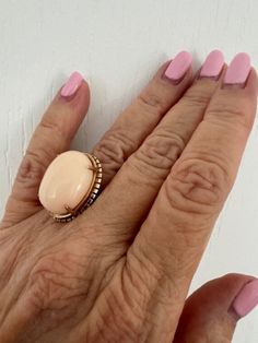 Vintage Angel Skin Coral Cabochon Ring set in 14K Yellow Gold  Circa 1970 Size 6 1/2 US Estate piece Comes in a gift box Eye Candy!! Victorian Oval Cabochon Rings For Gift, Victorian Cabochon Rings As Gifts, Victorian Cabochon Rings As A Gift, Vintage Cabochon Rings For Gifts, Vintage Cabochon Rings As Gift, Antique Rose Gold Rings For Gift, Victorian Cabochon Rings For Gift, Vintage Oval Cabochon Ring For Gift, Vintage Oval Cabochon Ring As Gift