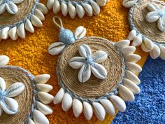 some white and blue decorations on a yellow towel