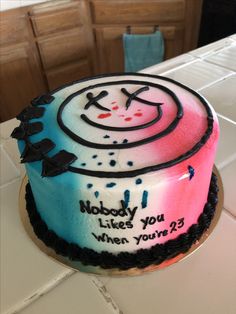 a cake that has been decorated with the words nobody likes you when you're 23