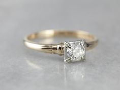 This vintage engagement ring is sweet and feminine, while still being easy to wear every day. The stone is encased in the square, white gold head. This protects the lovely European cut diamond, and also allows some light into the bottom to shine up through the stone. The shoulders have a simple motif, giving them a little texture and depth. All in all, this is a lovely piece! Metal: 14K Yellow and White Gold Gem: European Cut Diamond .50 Carats, I2 in Clarity, I in Color Gem Measurements: 4.9 mm Simple Motif, European Cut Diamond Engagement Ring, European Cut Diamond Ring, Retro Era, Vintage Engagement Ring, Engagement Ring Vintage, Round Rings, European Cut Diamonds, Vintage Engagement