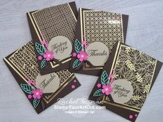 four cards with flowers on them sitting on top of a wooden table next to each other