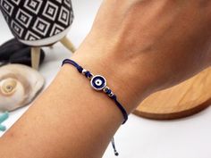 🧿 Add a touch of Greek style to your wardrobe with this minimalist Evil Eye bracelet! Made with quality materials, this bracelet features a small Evil Eye charm that will add a pop of color to your outfit. The Evil Eye symbol is an ancient Greek talisman that is believed to protect against negative energy, making this bracelet a perfect choice for anyone seeking both style and protection. ◼️ WHY THIS BRACELET? The adjustable length of the bracelet ensures a comfortable fit for any wrist size. T Minimalist Evil Eye Bracelet For Everyday, Minimalist Round Evil Eye Bracelet, Minimalist Evil Eye Bracelet, Minimalist Everyday Evil Eye Bracelet, Handmade Dainty Silver Evil Eye Bracelet, Silver Dainty Handmade Evil Eye Bracelet, Minimalist Adjustable Evil Eye Bracelet For Everyday, Minimalist Blue Evil Eye Bracelet For Everyday, Dainty Handmade Silver Evil Eye Bracelet