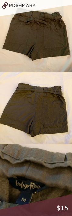 NWOT Army Green High Waisted Cloth Shorts New with out tags! Never worn! Cloth high waisted shorts with tie front and pockets Indigo Rein Shorts High Waist Vacation Bottoms With Belt Loops And Short Shape, Vacation Bottoms With Belt Loops And Short Length, Summer Bottoms With Paperbag Waist And Built-in Shorts, Summer Vacation Shorts With Belt Loops, Summer Beach Bottoms With Belt Loops, High Waist Shorts With Belt Loops For Vacation, Cloth Shorts, High Waisted Shorts, Short Outfits