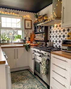 a kitchen with white cabinets and an oven