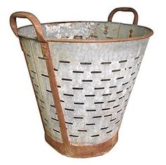 an old metal basket with handles