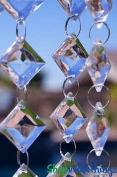 a wind chime hanging from the side of a building