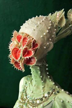 a close up of a woman's head with flowers on it