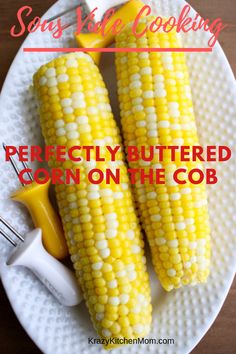 two corn on the cob are sitting on a white plate