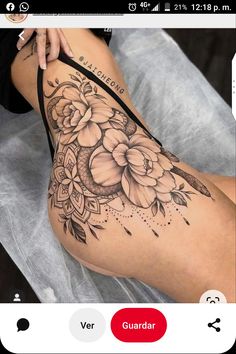 a woman's thigh with flowers and leaves on the side, while she is sitting down