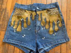 Beautiful high waisted shorts with lace up butt hand painted with dripping honey and cute little bees 🐝  Woman's size medium Bee Pants, Hand Painted Shorts, Art Crawl, Painted Shorts, Shorts With Lace, Painted Jeans, Designer Shorts, Honey Bee, High Waisted Shorts