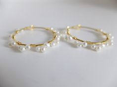 These beautiful fine hoop earrings have beautiful 2 mm freshwater creamy pearls The pearl have a good luster and organic shape They are wire wrapped around gold filled hoops with gold filled wire Diameter of the hoops is 3,00 cm- total diameter is 3,50 cm the pearls are 3 mm Thank you for visiting my shop and if you wish personalized jewels or wish more details, please contact me. I'll be happy to help Thanks for stopping by. See my other handcrafted precious jewels here: http://www.etsy.com/sho Gold Wire Wrapped Pearl Hoop Earrings, Handmade Pearl Yellow Gold Hoop Earrings, Handmade Yellow Gold Pearl Hoop Earrings, Handmade Yellow Gold Hoop Earrings With Pearl, Delicate Gold Hoop Pearl Earrings, Delicate Gold Wire Wrapped Hoop Earrings, Dainty Wire Wrapped Gold Hoop Earrings, Rainbow Gemstones, Quartz Colors