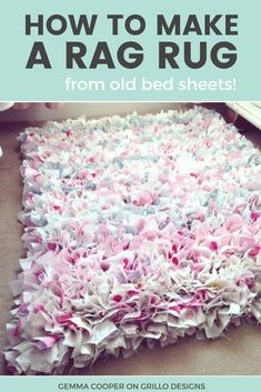 a pile of pink and white rag rugs on the floor in a living room