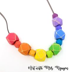 a multicolored wooden bead necklace on a white background