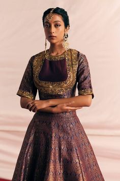 Burnt maroon and blue brocade lehenga with attached can-can, all over vintage woven pattern. Paired with woven blouse with metallic sequin, thread work and border embroidered dupatta. - Aza Fashions Traditional Meenakari Dresses For Festive Occasions, Festive Saree Dress With Meenakari Details, Brocade Cutdana Anarkali Set For Reception, Festive Designer Dresses With Meenakari, Festive Designer Meenakari Dresses, Festive Meenakari Designer Dresses, Brocade Meenakari Sets For Reception, Brocade Sets With Meenakari For Reception, Fitted Blouse Piece With Meenakari For Wedding