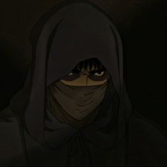 a person wearing a hooded hood and looking at the camera with an evil look on their face