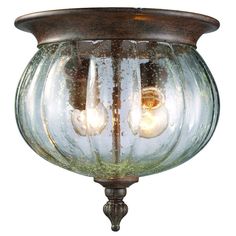 an outdoor light fixture with three lights on it