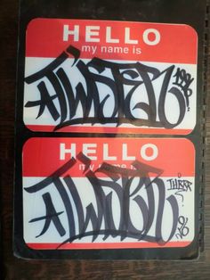 two stickers with the words hello my name is written in black and red on them