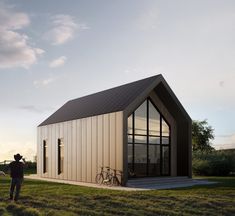 a small house with two bikes parked outside