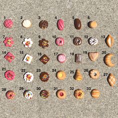 a number of different types of donuts on the ground