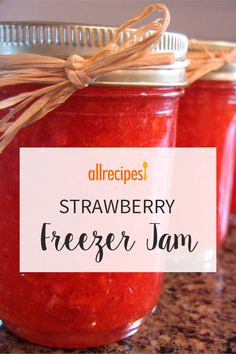 strawberry freezer jam in jars with text overlay reading allrecipes strawberry freezer jam