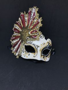 Half Face,Fan Mask. Size: one size Traditional and original papier-mache Venetian mask, handmade and decorated with acrylic color,lace and stuggles. The mask has double paper mache. All our masks are handmade papier-machè masks made in Venice. Our decorators use techniques typical of the Venetian tradition such as stucco, acrylics, gold and silver-leaf, macramè, passementerie, pearls and crequelè to give you a wide range of masks. The mask could be slightly different because are all handmade and Venice Mask, Romantic Period, Costume Masks, Venetian Mask, Original Dolls, Half Face, Photo Mask, Historical Romance, The Mask