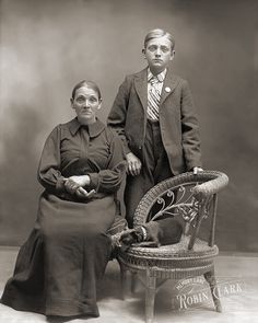 an old black and white photo of two people