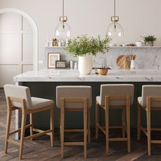 a kitchen with marble counter tops and bar stools