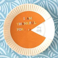 an orange and white paper plate with the words i am grateful for