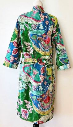 This delightful 100% cotton wrap kimono is a breath of fresh air. A full kaleidoscope of bright colors like a blooming spring garden. Constructed with high quality cotton, handmade and kantha embroidered. Designed as a traditional short kimono with an extra wide front band showcasing kantha embroidery created by hand. This embroidery is also carried throughout the garment. Special detailing is noticable throughout the garment, double width hem panel, etc. The bright color pallet works well with Multicolor Cotton Kimono With Floral Print, Multicolor Floral Print Cotton Kimono, Cotton Kimono With Floral Print For Spring, Spring Cotton Kimono With Floral Print, Bohemian Cotton Patterned Kimono, Spring Cotton Kimono With Patchwork, Multicolor Cotton Kimono With Patchwork, Bohemian Cotton Kimono With Floral Print, Multicolor Cotton Kimono With Kimono Sleeves