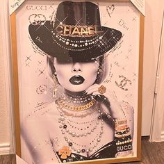 a painting of a woman wearing a black hat with pearls and jewels on her face