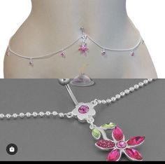 a woman's belly chain with pink and green flowers on it