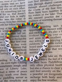 a beaded bracelet with words that spell out the word's name on it