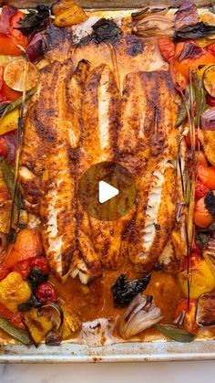 a pan filled with meat and vegetables on top of a table