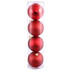 three red christmas balls in a clear tube