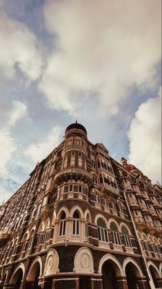 a very tall building with many windows and balconies