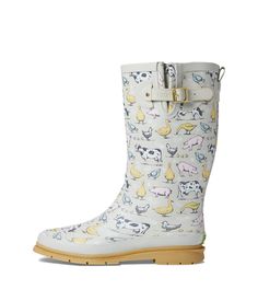 a white boot with animals on it and yellow rubber outstrats for the bottom