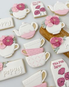 decorated cookies with pink flowers and teapots