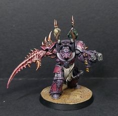 a painted warhammer with large horns and spikes