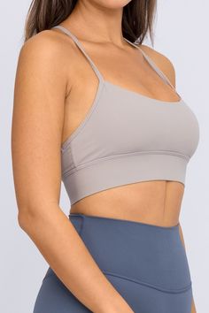 The Qiana Sports Bra - made with our UltraLux Blend, you will be hard pressed to find a better fabric quality than this. Featuring a single back strap for supreme mobility, this sports bra is perfect for that morning jog or a lengthy marathon. This bra will not disappoint, we guarantee it. UltraLux Blend - Superior 80/20 Nylon Spandex Unbelievably Buttery soft Single Back Strap Design for full mobility Perfect for Running Reflective Logo Includes removable cups Tested & Approved by the pros. Strappy Back Sports Bra With Built-in Padding For Yoga, Functional High Stretch Bra With Built-in Padding, Sports Bra With Strappy Back And Built-in Bra, Sports Bra With Built-in Padding For Light Exercise, Functional Sports Bra With Built-in Bra For Training, Compressive Training Bra With Built-in Padding, Sporty Sports Bra With Strappy Back And Built-in Padding, Racerback Sports Bra With Built-in Padding For Light Exercise, Micro-elastic Gym Bra With Built-in Support