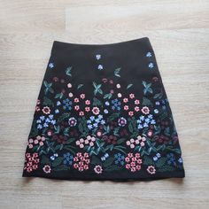 Zara Floral Embroidered Mini A-Lined Skirt Zip Lined Black 100% Polyester Condition Is Pre-Owned In Good Condition. Please Note: -The Real Color Of The Item May Be Slightly Different From The Pictures Shown On Website Caused By Many Factors. -Don't Go By Size Number, Do Check Measurements Listed Below To Determine If The Item Will Fit. Measurements: Approximately (Laying Flat). -Waist: 15 Inches -Hip: 20 Inches -Length: 20 Inches The Condition Guide: -New With Tags - Never Been Used Condition. T Zara Embroidered Skirt For Spring, Zara Embroidered Fitted Skirt, Fitted Embroidered Zara Skirt, Spring Embroidered Skirt From Zara, Fitted Skirt With Multicolor Floral Embroidery, Reworking Clothes, Zara Skirts, Black Color, Womens Skirt