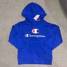 Youth Size 6. New With Tags. Blue Hooded Top With Letter Print, Pink Champion Hoodie, Blue Champion Hoodie, Grey Zip Hoodie, Champion Sweatshirt, Champion Hoodie, Blue Sweatshirt, Cool Hoodies, Boys Hoodies