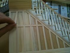 someone is working on some wooden stairs