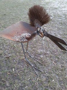 an odd looking bird made out of metal