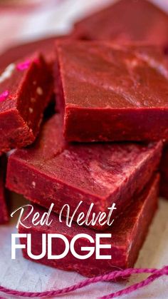 some red velvet fudges are stacked on top of each other with the words, real velvet fudge