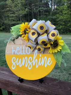 a yellow sign that says hello sunshine with sunflowers