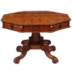 an old wooden table with two drawers on one side and four legs at the other