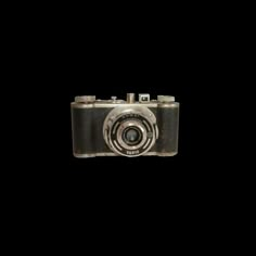 an old camera is shown against a black background