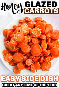 a white plate topped with sliced up carrots on top of a cloth covered table