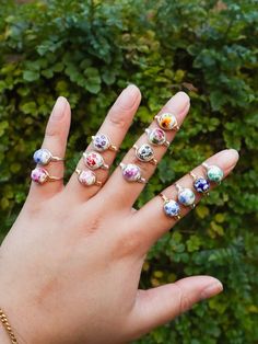 These are Handmade, Wire Wrapped Floral Patterned Ceramic/Porcelain Bead Rings in Silver/Gold/Rose Gold. You will be able to customize your own ring based on size, floral print, and wire color :) The rings are handmade and available in sizes 2-15 (US). These rings feature a round floral bead of your choice, wrapped in wire. *PLEASE NOTE* Not all rings will look the same as what is featured in the pictures!! Your ring will not be identical to the picture due to the nature of each bead. Each ring will be unique as the print varies on some beads, please let me know if you would like the flower to be the main subject, rather than some of the leaves and some of the flower. Some beads feature a pattern that varies across the outside of the bead, rather than one uniform print all around. :) The w Handmade White Enamel Ring, Adjustable White Enamel Ring, White Oval Enamel Ring Gift, Handmade White Enamel Ring For Gift, Handmade White Enamel Ring Gift, White Ceramic Jewelry For Gifts, White Ceramic Jewelry As A Gift, White Ceramic Jewelry Gift, White Oval Flower Ring Gift