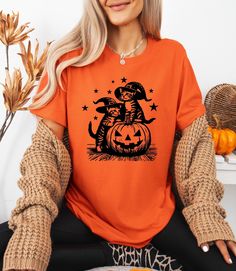 Cat Witches Funny Halloween T-Shirt, Vintage Cat Witch Shirt, Funny Halloween T-Shirt, Halloween Pumpkin Shirt, Halloween Pumpkin Cat Shirt **Product Overview   We proudly offer shirts from the Bella Canvas and Gildan SoftStyle collections, both recognized for their superior industry standards. *Bella Canvas:*   - Available in unisex sizing   - Lightweight fabric at 4.2 oz   - Solid colors are crafted from 100% Combed and Ring-Spun Cotton   - Athletic Heather contains 90% Combed and Ring-Spun Co Halloween Cat Print Crew Neck Top, Halloween Orange T-shirt With Cartoon Print, Orange Halloween T-shirt With Cartoon Print, Orange Halloween Cartoon Print T-shirt, Short Sleeve T-shirt With Cat Print For Halloween, Halloween Graphic Tee With Cat Design, Spooky Halloween T-shirt With Cat Design, Halloween Cat Print Graphic Tee, Halloween Orange Crew Neck T-shirt